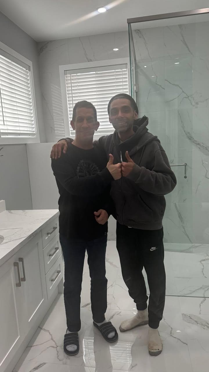 Finished marble bathroom — another satisfied client. Custom walk-in shower build.